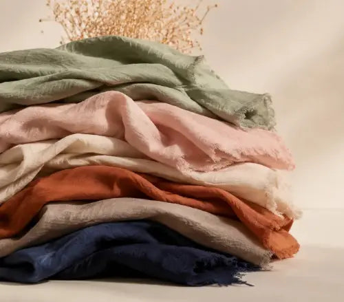 Soft linens and dried florals mobile-optimized